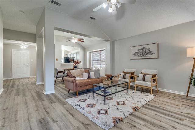 Step into the heart of this home, where the family room is bathed in abundant natural light. With its large windows and open feel, this bright and airy space invites warmth and comfort—perfect for relaxing or entertaining.