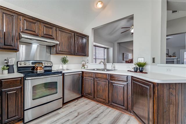The formal dining room features a large window that floods the space with natural light, creating a warm and inviting atmosphere.