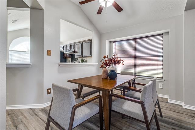 The open design allows for effortless flow, offering views of both the family room and kitchen, making it the perfect setting for hosting dinner parties or enjoying intimate family meals."