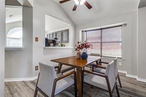 The open design allows for effortless flow, offering views of both the family room and kitchen, making it the perfect setting for hosting dinner parties or enjoying intimate family meals."