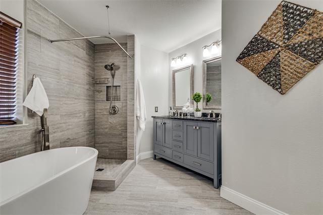 The secondary bedroom is bright and welcoming, with natural light streaming through the large windows. Recently updated with plush carpet and a new pad, this room offers both comfort and style, creating a cozy retreat for relaxation or a peaceful night’s rest