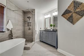 The secondary bedroom is bright and welcoming, with natural light streaming through the large windows. Recently updated with plush carpet and a new pad, this room offers both comfort and style, creating a cozy retreat for relaxation or a peaceful night’s rest