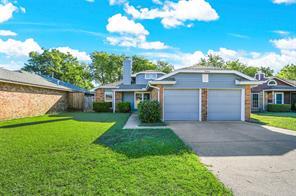 Living room with updated windows, high vaulted ceiling, ceiling fan, a tile fireplace, and dark hardwood / wood-style flooring