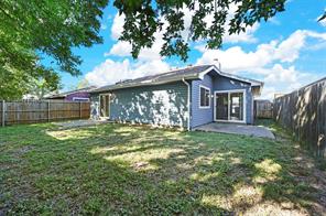 Back of property featuring a 2nd patio and a yard