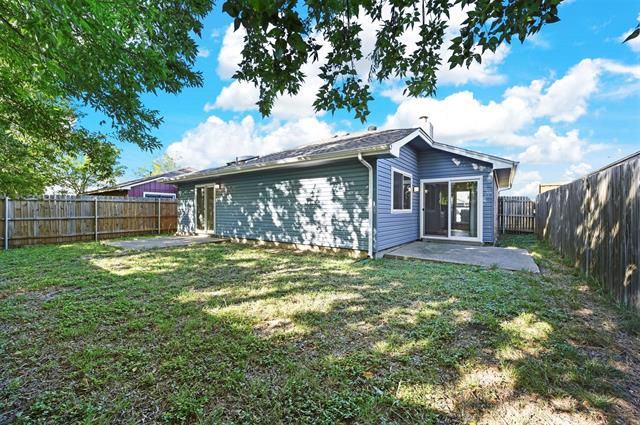 Back of property featuring a 2nd patio and a yard