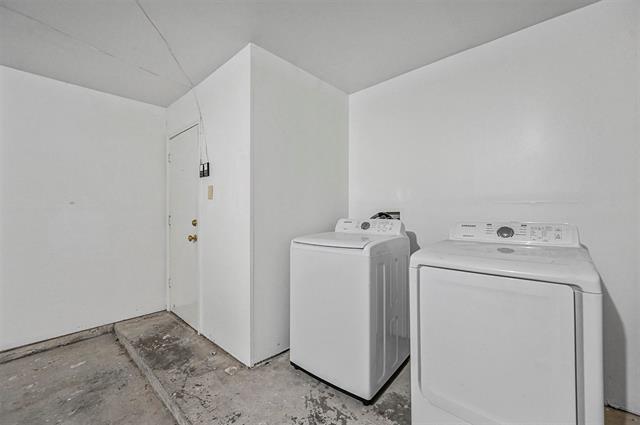 View of front facade with a lawn and a garage