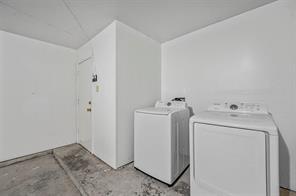 View of front facade with a lawn and a garage