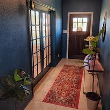 Foyer featuring French doors to bonus room (office)